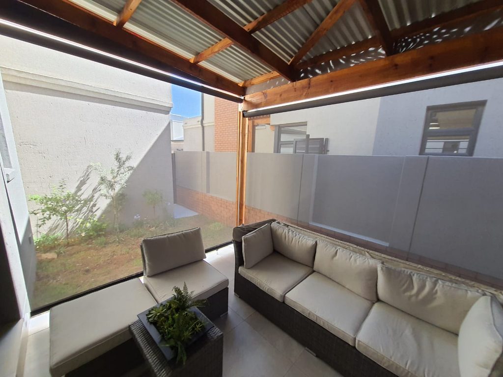 Out door roller blinds _ sheer weave - free hang - installed over covered patio